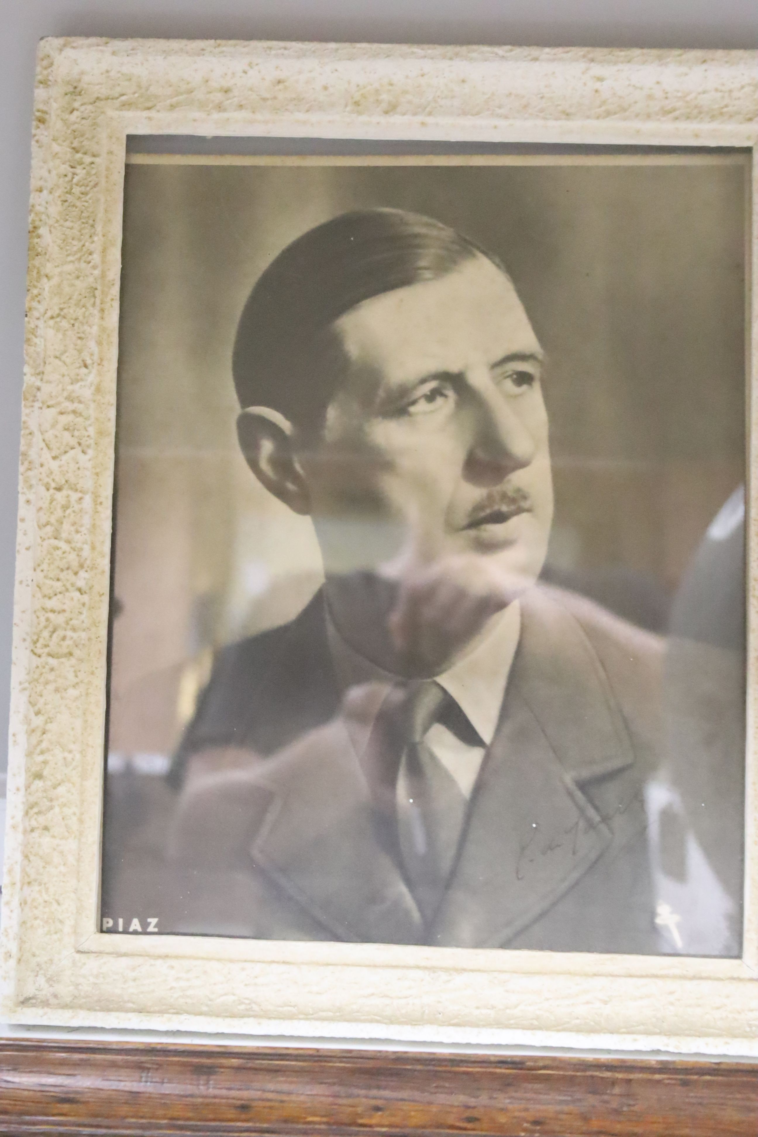 Monochrome photograph bearing signature Gen. De Gaul, dated 1949, together with a Liberation poster, Toulon 1944, a Liberation of Maastricht plate, 1944, and a rare Swiss Red Cross Prisoner's Parcels box